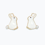 Pair of rabbit-shaped earrings with pearl details on a white background. Available at Be Charmed