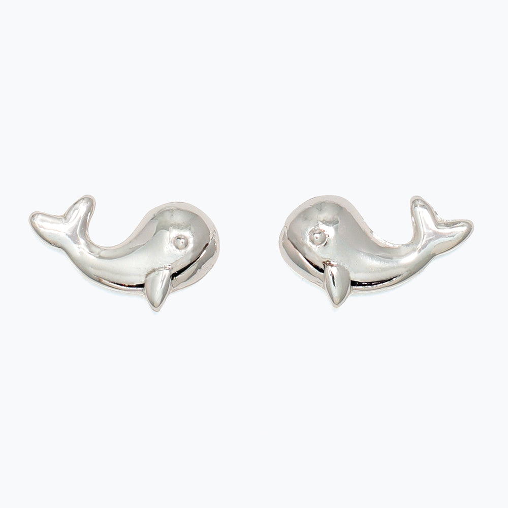 Pair of silver whale-shaped earrings on a white background. Available at Be Charmed