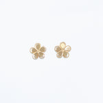 Cuties gold-tone cutout flower stud earrings featuring delicate floral openwork design on hypoallergenic posts. Elegant and lightweight. Available at Be Charmed