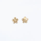 Cuties gold-tone cutout flower stud earrings featuring delicate floral openwork design on hypoallergenic posts. Elegant and lightweight. Available at Be Charmed