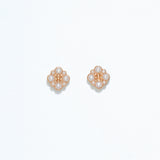 Cuties gold and pearl stud earrings with round faux pearls set in shiny gold-tone metal, designed for hypoallergenic wear. Timeless and elegant accessory for daily or special occasion use. Available at Be Charmed.