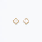 A pair of pearlized clover design earrings on a white background. Available at Be Charmed