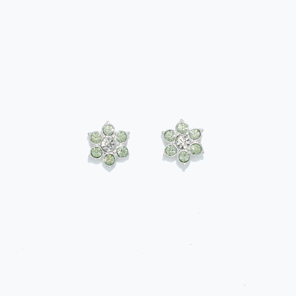 A pair of crystal flower earrings with pink petals and a central clear crystal, on a white background. Available at Be Charmed