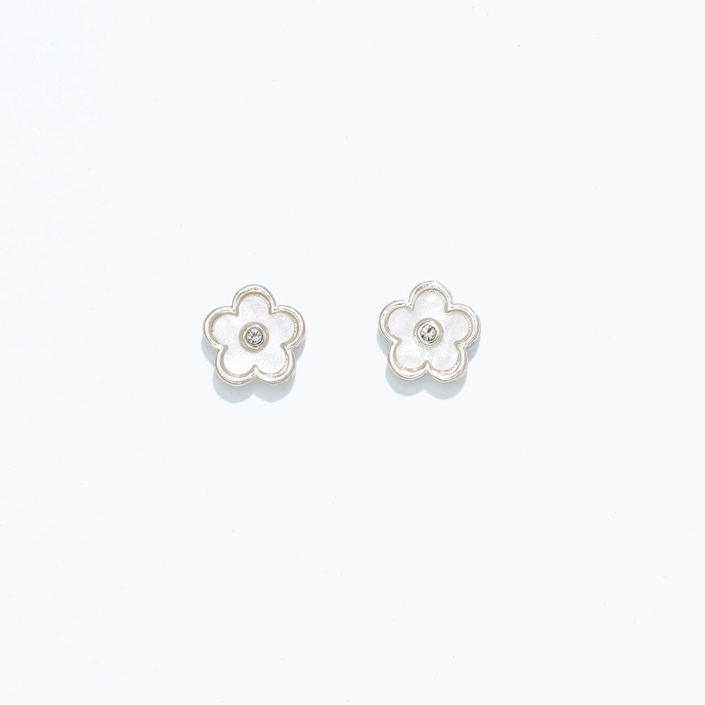 A pair of pearlized flower design hypoallergenic stainless steel post earrings. Available at Be Charmed