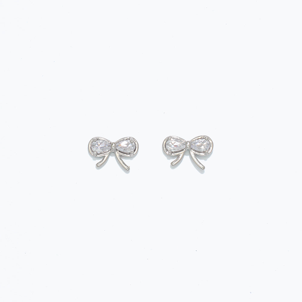 Silver Cuties CZ Bow Stud Earrings in sparkling cubic zirconia with hypoallergenic stainless‑steel posts—Available at Be Charmed