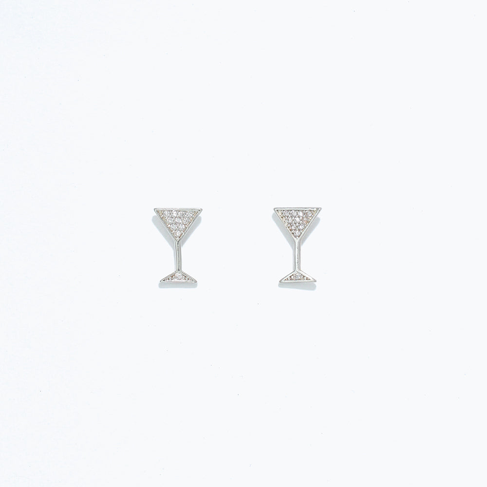 A pair of silver stud earrings in the shape of martini glasses, featuring a crystal design. Available at Be Charmed