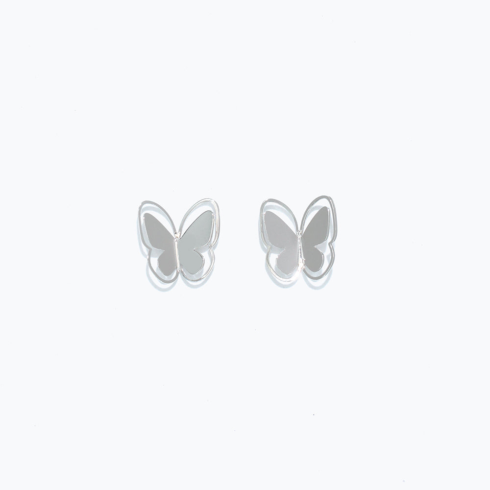 Cuties silver cutout butterfly stud earrings with delicate openwork design, hypoallergenic and lightweight. Available at Be Charmed