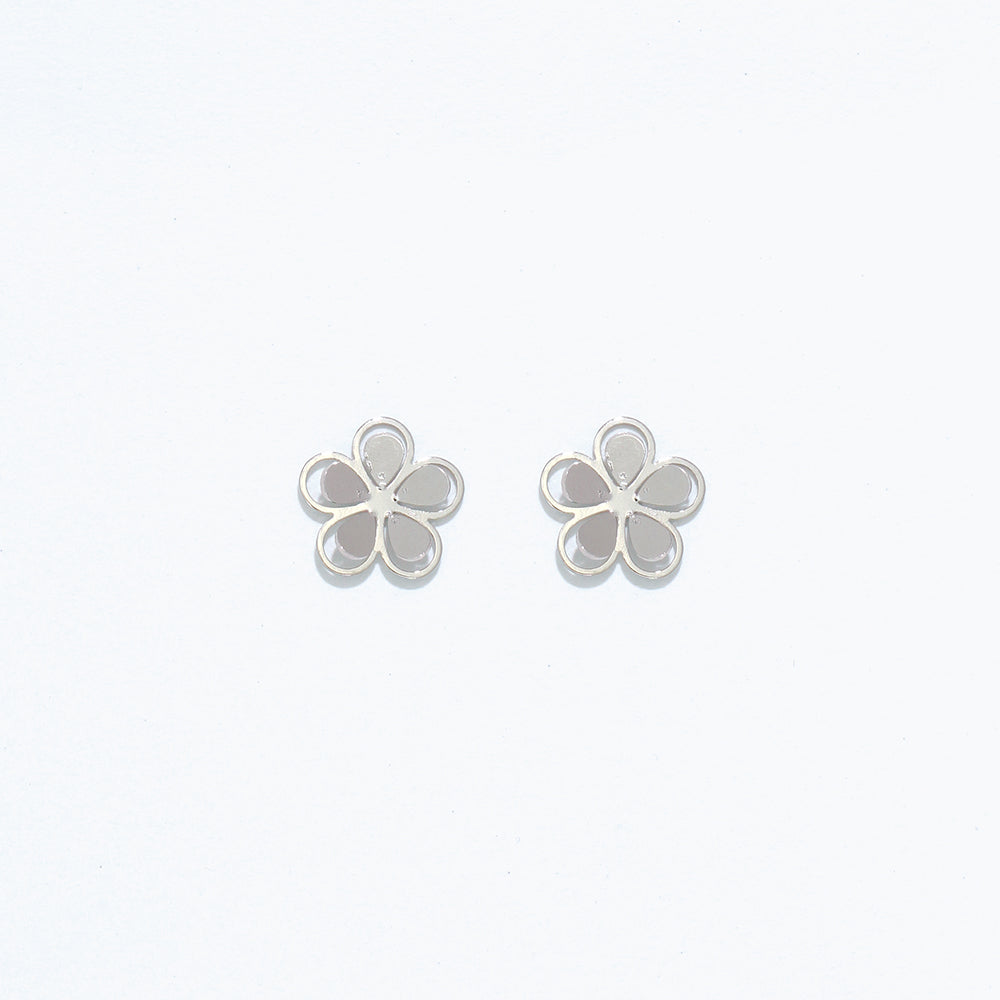 Silver Cuties cutout flower stud earrings featuring delicate floral openwork design on hypoallergenic posts. Elegant and lightweight. Available at Be Charmed