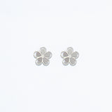 Silver Cuties cutout flower stud earrings featuring delicate floral openwork design on hypoallergenic posts. Elegant and lightweight. Available at Be Charmed