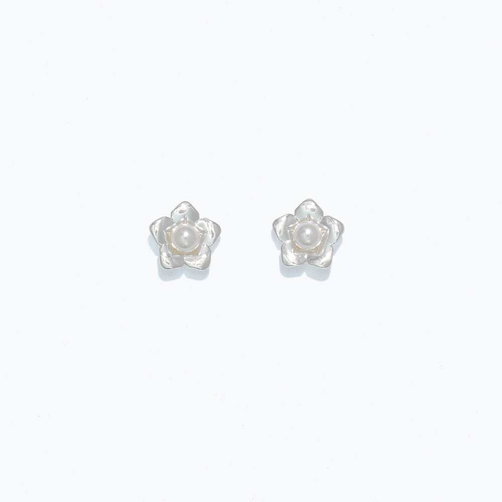 Silver Cuties Flower With Pearl Stud Earrings: delicate flower-shaped studs with lustrous faux pearl center and hypoallergenic stainless steel posts—Available at Be Charmed 