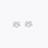 Silver Cuties Pretzel Heart Earrings with glossy gold heart‑twist design and hypoallergenic stainless‑steel posts—Available at Be Charmed