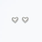 A pair of heart-shaped stud earrings on a white background, likely to be used as a playful accessory for personal jewelry. Available at Be Charmed