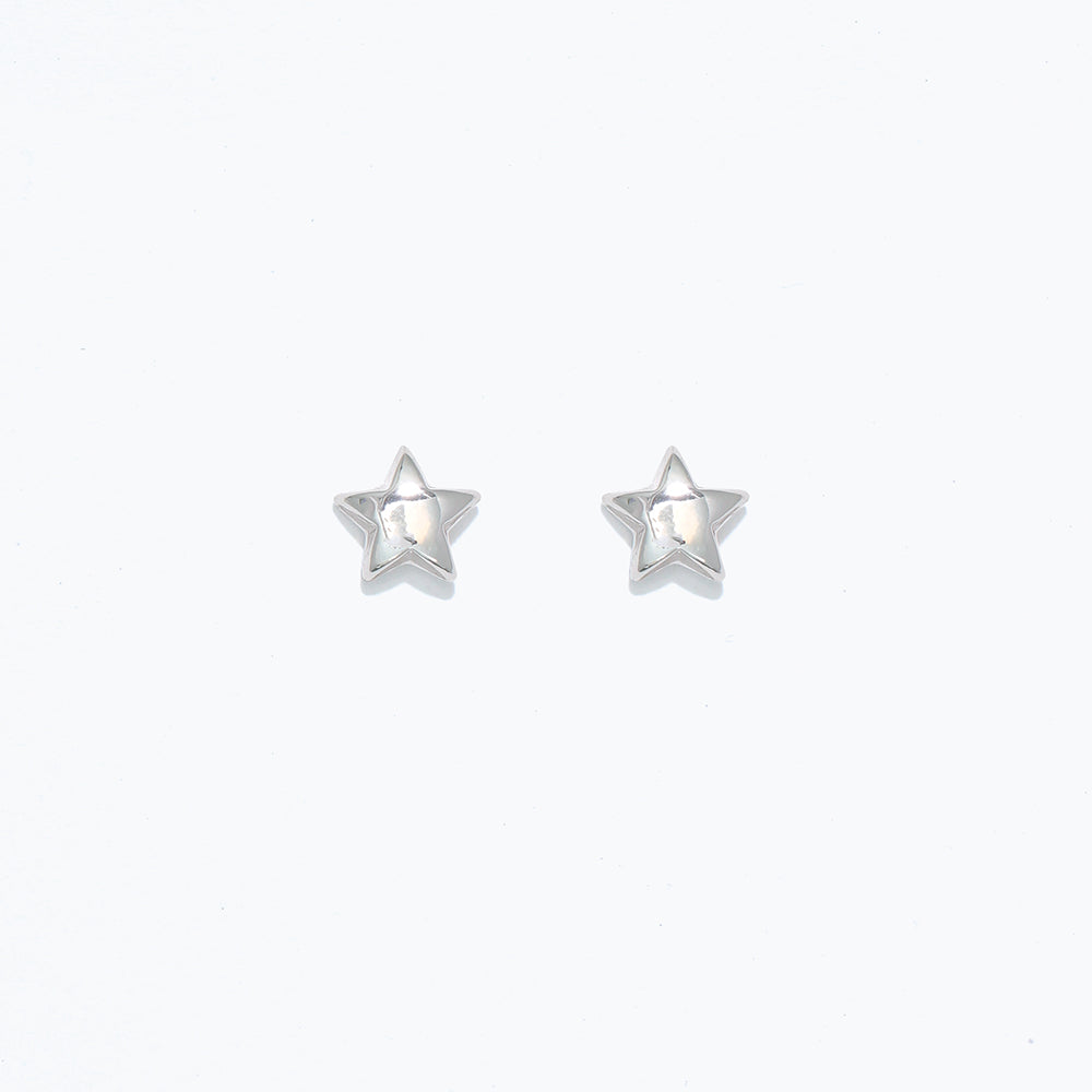 A pair of silver star-shaped hypoallergenic stud earrings on a white background. Available at Be Charmed
