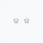 A pair of silver star-shaped hypoallergenic stud earrings on a white background. Available at Be Charmed