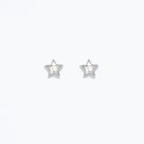 A pair of silver star-shaped hypoallergenic stud earrings on a white background. Available at Be Charmed
