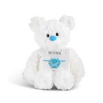 White plush bear with 'December' card with a heart bracelet on a white background. Available at Be Charmed