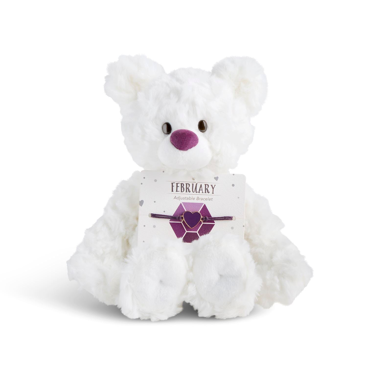 White plush bear with 'February' card with a heart bracelet on a white background. Available at Be Charmed