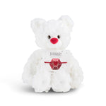 White plush bear with 'January' card with a heart bracelet on a white background. Available at Be Charmed