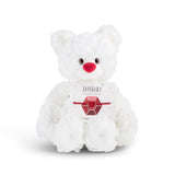 White plush bear with 'January' card with a heart bracelet on a white background. Available at Be Charmed