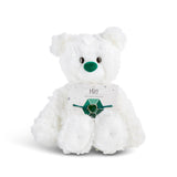White plush bear with 'may' card with a heart bracelet on a white background. Available at Be Charmed