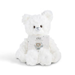 White plush bear with 'April' card with a heart bracelet on a white background. Available at Be Charmed