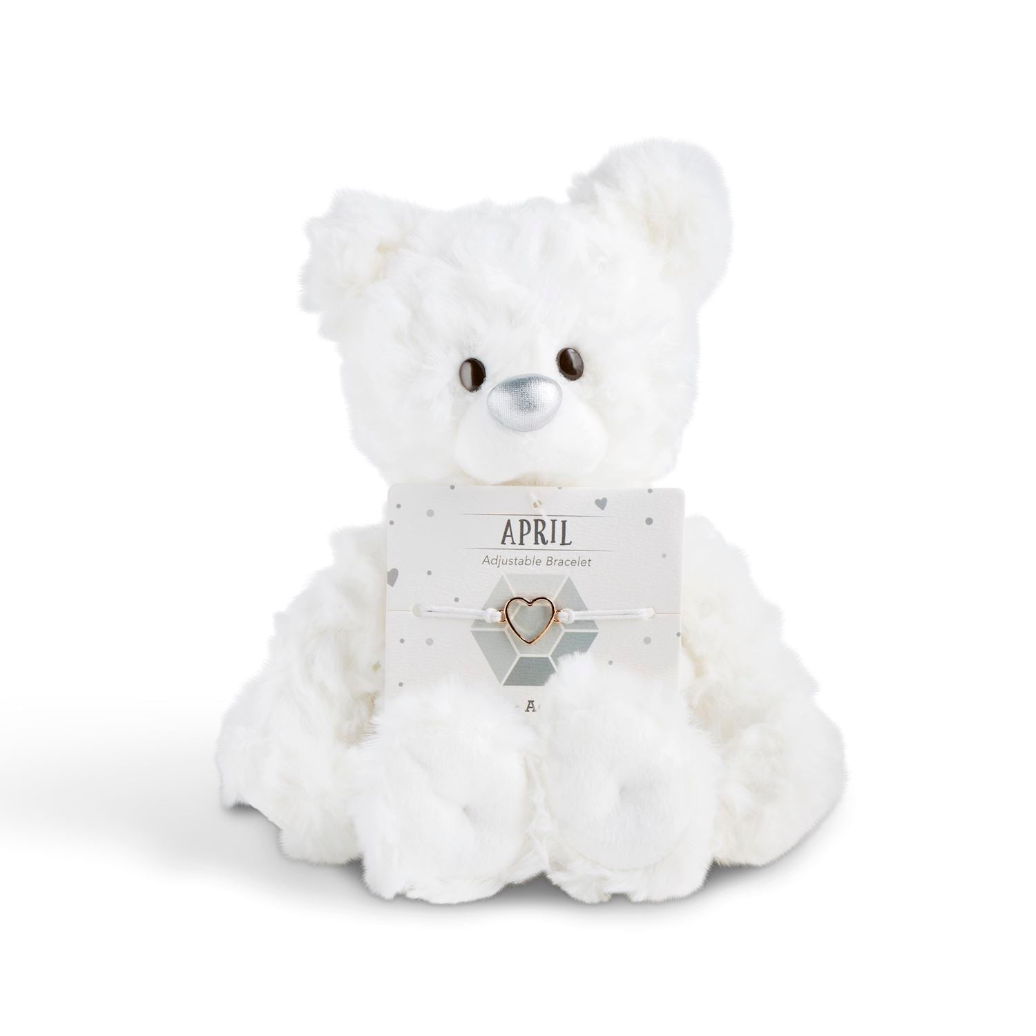 White plush bear with 'April' card with a heart bracelet on a white background. Available at Be Charmed