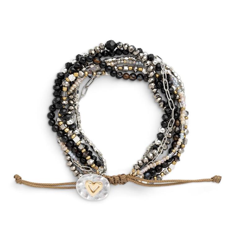 Multistrand black beaded bracelet with heart charm on a white background. Available at Be Charmed