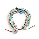Multistrand turquoise beaded bracelet with heart charm on a white background. Available at Be Charmed