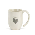 Demdaco Brave Heart Mug in cream stoneware with a heart design, available at Be Charmed.