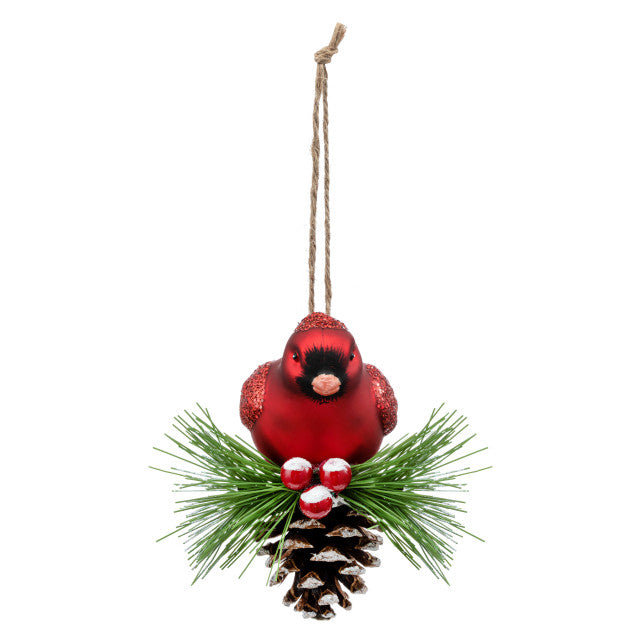 Handcrafted Demdaco Cardinal on Pinecone glass ornament (3.5″×4″) with faux evergreen and berries trim—Available at Be Charmed.