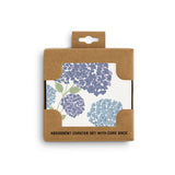Packaged set of absorbent coasters with floral design on a white background. Available at Be Charmed