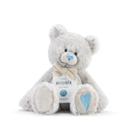 A plush teddy bear with a birthstone theme, featuring a ribbon around its neck that indicates the month of December.  Available at Be Charmed