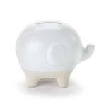 Demdaco white ceramic Elephant Bank with upturned trunk, coin slot and silicone stopper—charming nursery décor and savings tool. Available at Be Charmed.