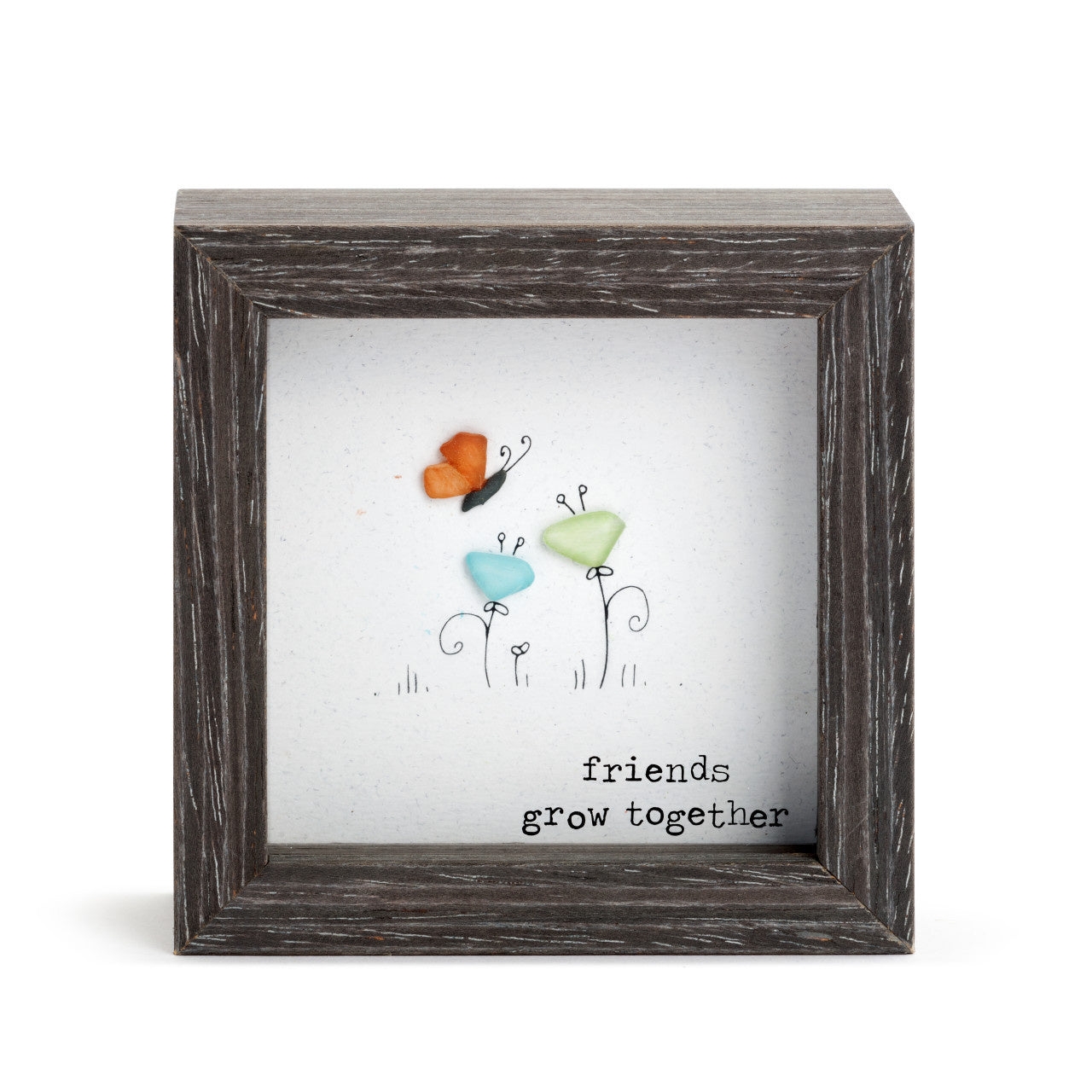 Demdaco “Friends Grow Together” shadow box – inspirational pebble art by Sharon Nowlan, 4″ square with glass frame. Available at Be Charmed