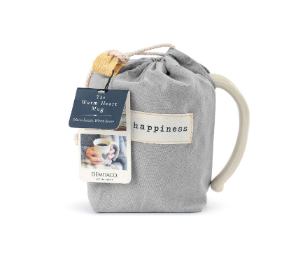  Demdaco “Happy” Heart Mug in pouch, 16 oz stoneware with heart cutout and “Happy” sentiment, cream finish—microwave & dishwasher safe—available at Be Charmed.