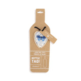 On Display Card of Demdaco Peace Love Joy heart bottle tag decorative stopper, resin festive design—Available at Be Charmed