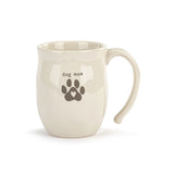 White mug with 'dog mom' and paw print design on a white background. Available at Be Charmed