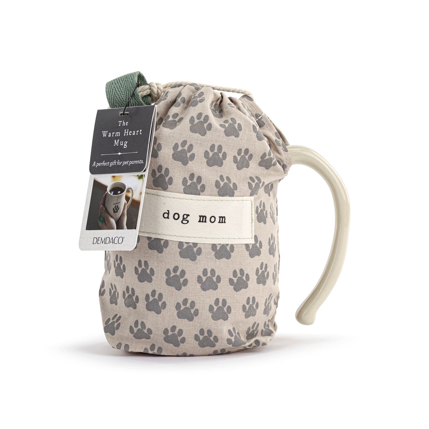 Drawstring bag with paw prints and a mug labeled 'dog mom' on a white background. Available at Be Charmed