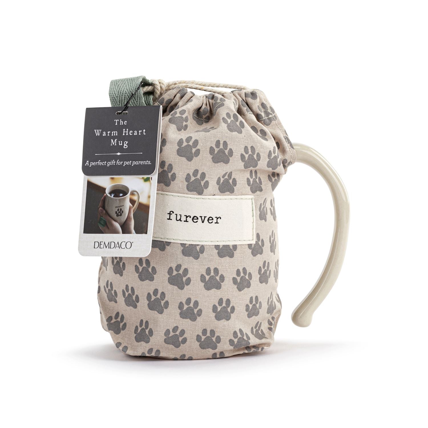 Drawstring bag with paw print pattern and 'furever' text, featuring a mug inside, on a white background. Available at Be Charmed