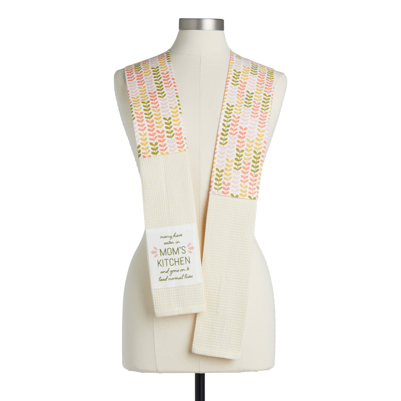 Demdaco “In Mom’s Kitchen” 69″ cotton towel boa in peach waffle knit, printed with “Many have eaten in Mom’s kitchen…” message—available at Be Charmed.