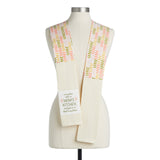 Demdaco “In Mom’s Kitchen” 69″ cotton towel boa in peach waffle knit, printed with “Many have eaten in Mom’s kitchen…” message—available at Be Charmed.