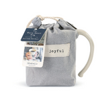 Demdaco Joyful Heart Mug in cream stoneware with a heart design in fabric pouch, available at Be Charmed.