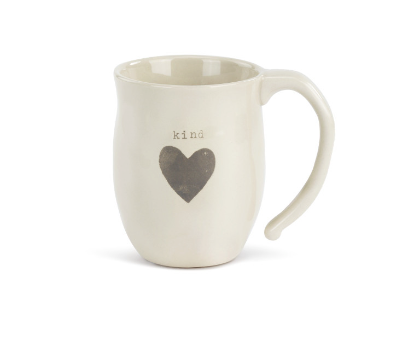 A beige ceramic mug with the word 'kind' and a heart shape on it. Available at Be Charmed