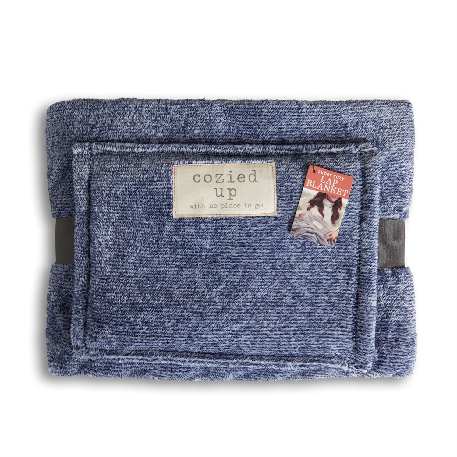 Blue lap blanket with 'cozied up' label on a white background. Available at Be Charmed