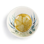 Overhead view of Demdaco Lemons Melamine Dip Bowl, 4.5″ round melamine bowl featuring lemon pattern with bamboo base—Available at Be Charmed.