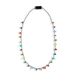 Demdaco Lit Holiday Necklace with LED light pendant on festive cord—glows during holiday gatherings. Available at Be Charmed.