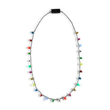 Demdaco Lit Holiday Necklace with LED light pendant on festive cord—glows during holiday gatherings. Available at Be Charmed.