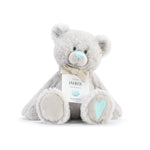 A plush teddy bear with a birthstone theme, featuring a ribbon around its neck that indicates the month of March. Available at Be Charmed