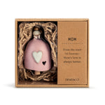 Ceramic Demdaco Mom Mini Inspired Bell (~2″×2.5″) pictured in box; with hanging cord and wood bead—uplifting decor with inspirational message. Available at Be Charmed.