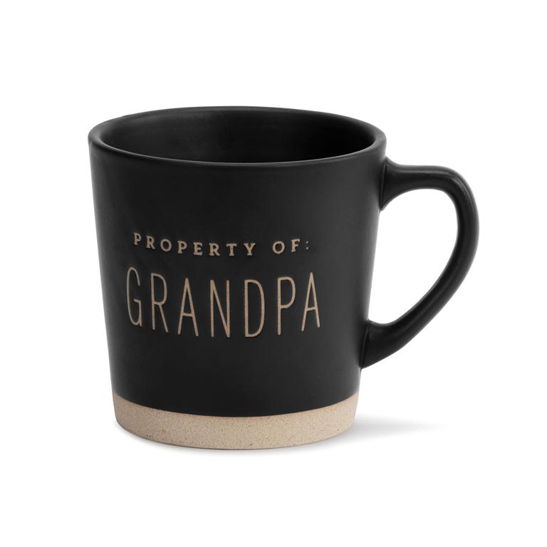 Black mug with 'Property of Grandpa' text on a white background. Available at Be Charmed